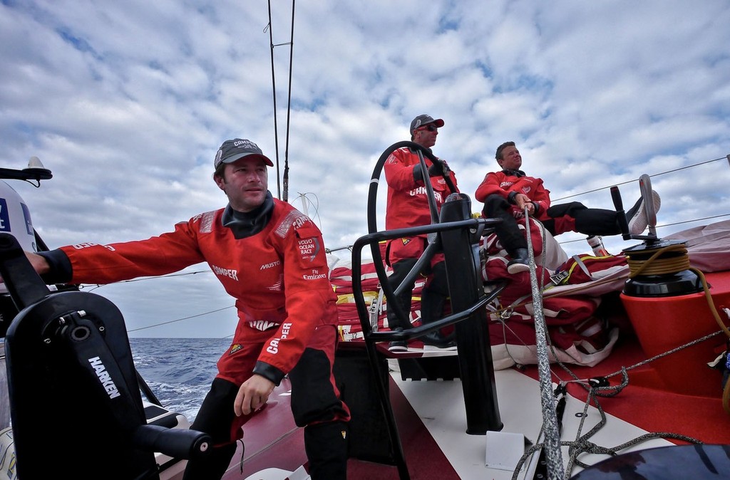Nick Burridge, Rob Salthouse and Adam Minoprio with full aft sail stack and triple head sails ready for the approaching gale winds onboard CAMPER with Emirates Team New Zealand during leg 8 of the Volvo Ocean Race 2011-12 © Hamish Hooper/Camper ETNZ/Volvo Ocean Race